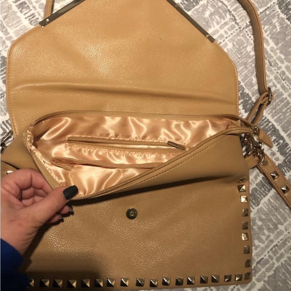 Tan studded purse.